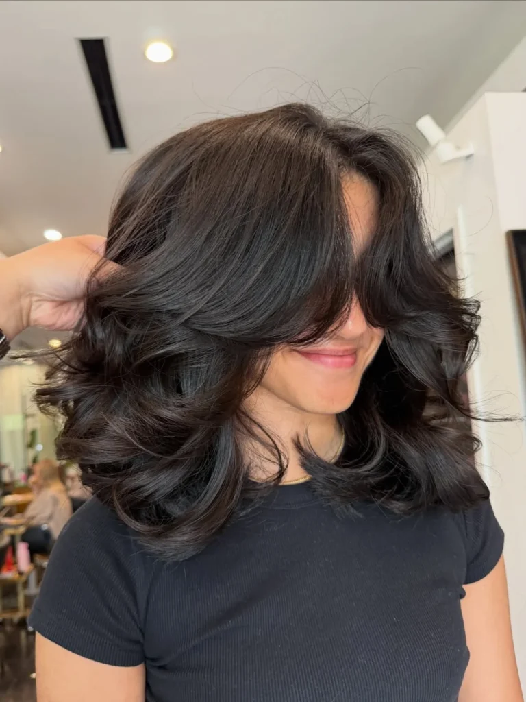  Voluminous Curled-Under Shoulder Length Cut 