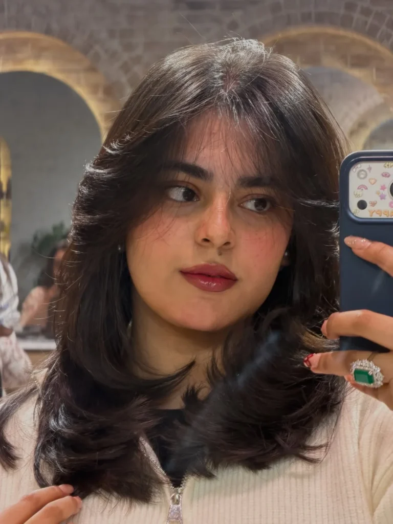 Flipped-Out Shoulder Length Layers with Curtain Bangs 