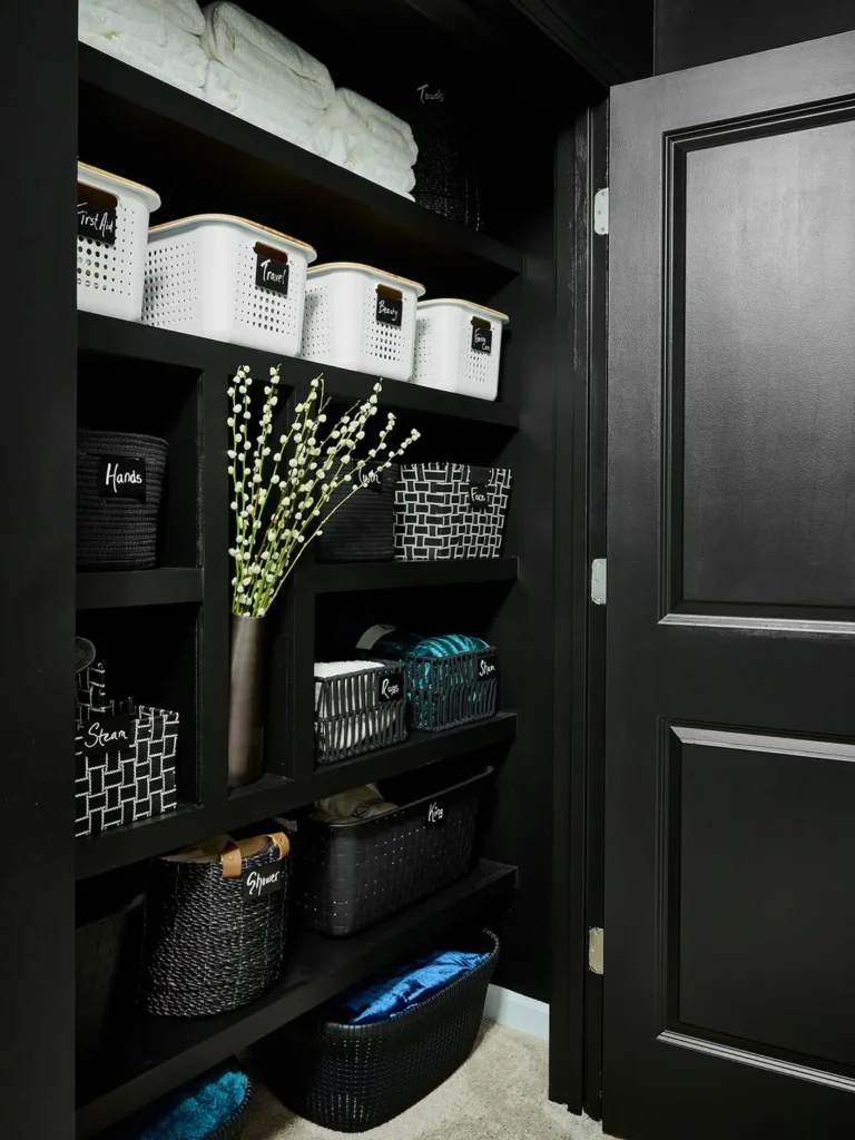 Moody Black Linen Closet with Labeled Bins 