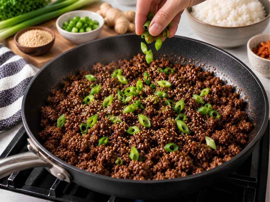 Finish and Serve Remove the skillet from heat and stir in sliced green onions and sesame seeds.