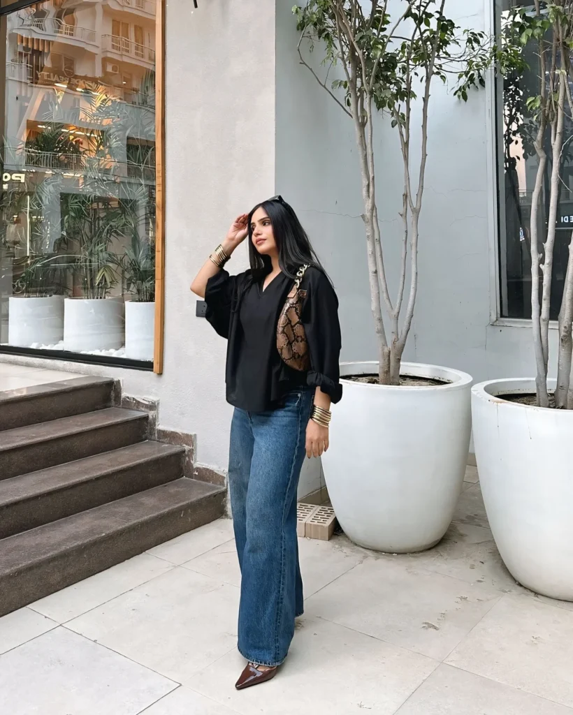 Black Blouse with Wide-Leg Blue Jeans
