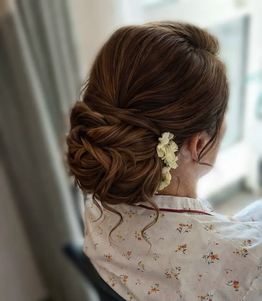Elegant Twisted Floral Low Bun for Medium Hair 