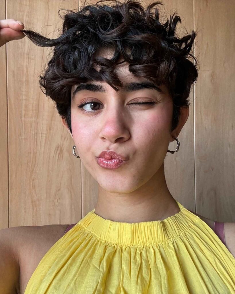 Curly Pixie Cut With Soft Bangs