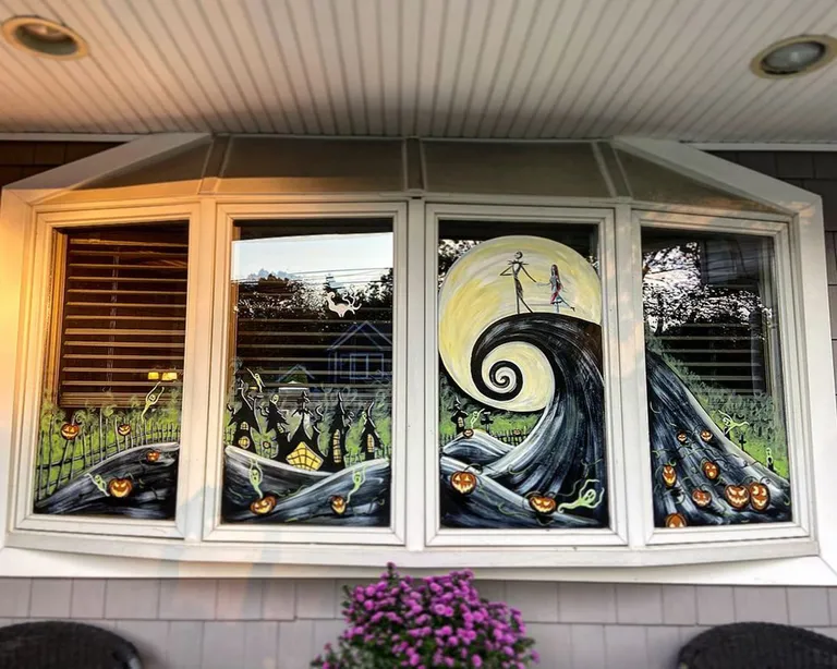 Halloween bay window painting featuring Jack and Sally on a black spiral hill beneath a yellow moon, surrounded by haunted houses, glowing pumpkins, and ghostly figures.