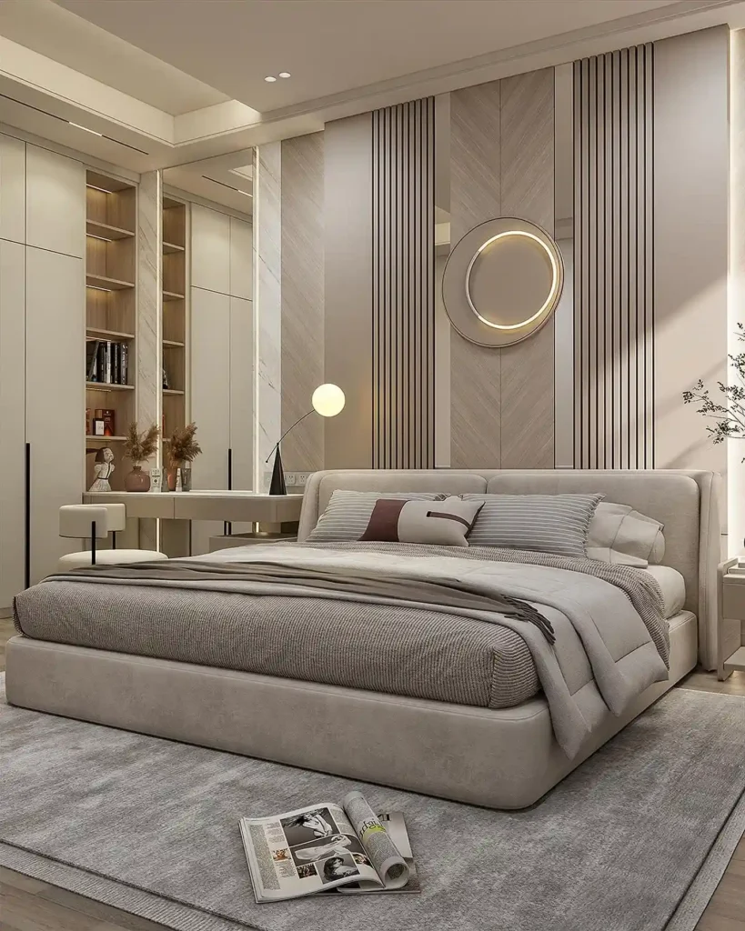 Beige upholstered bed in front of a slatted wall with a round glowing light